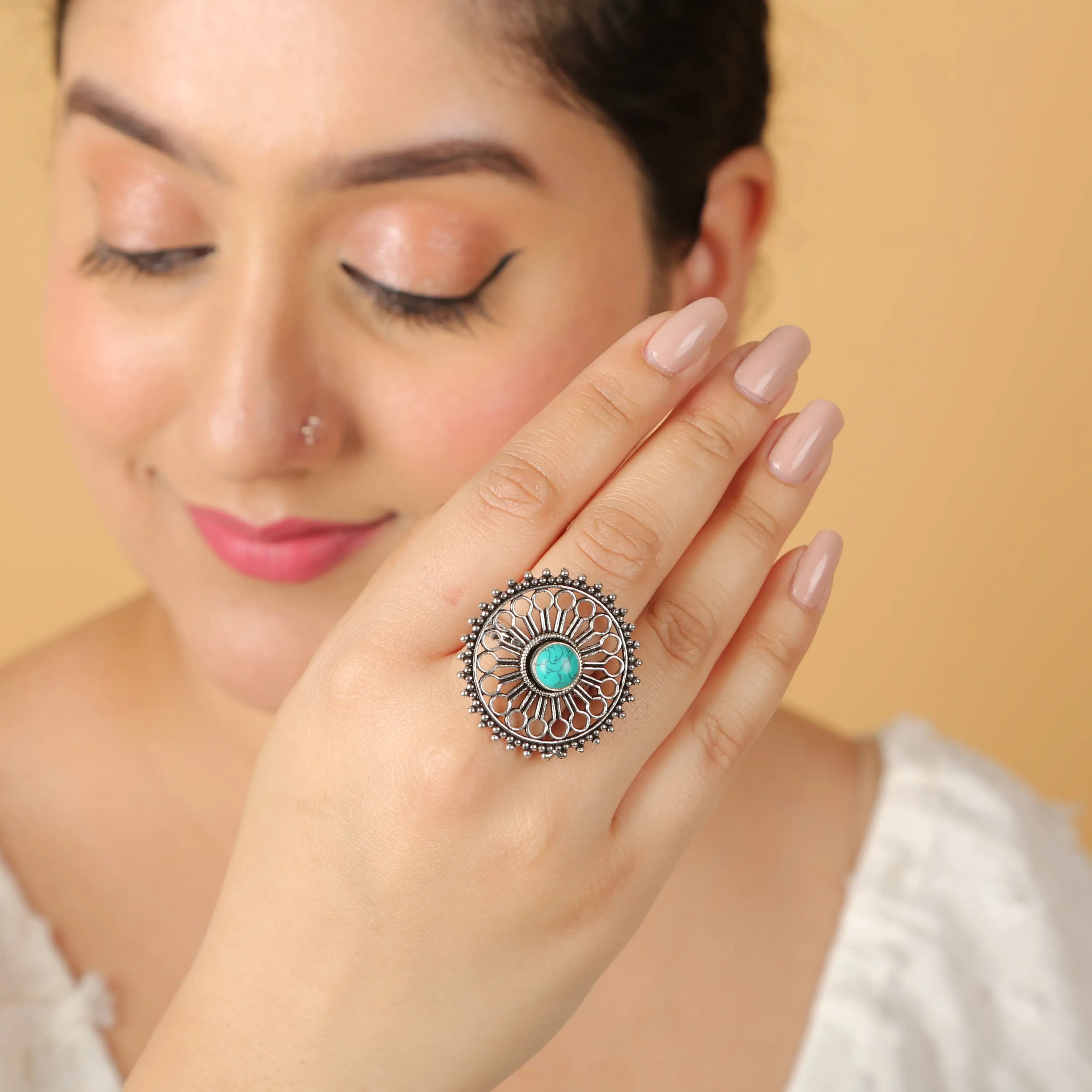 Oxidised silver turquoise stone ring on model's hand — on-model jewellery photography Udaipur