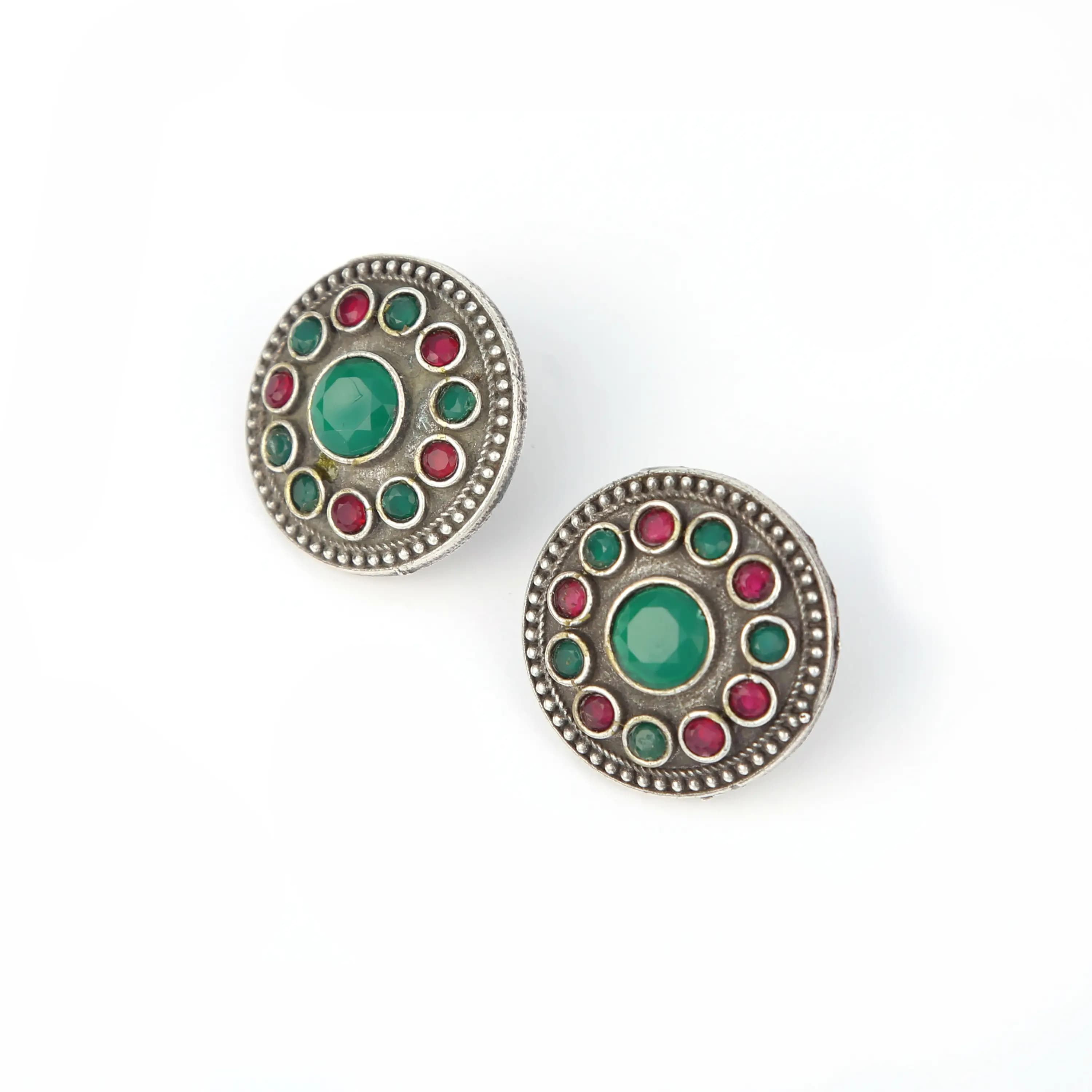 Oxidised silver stud earrings with green and red stones — silver jewellery photography Udaipur
