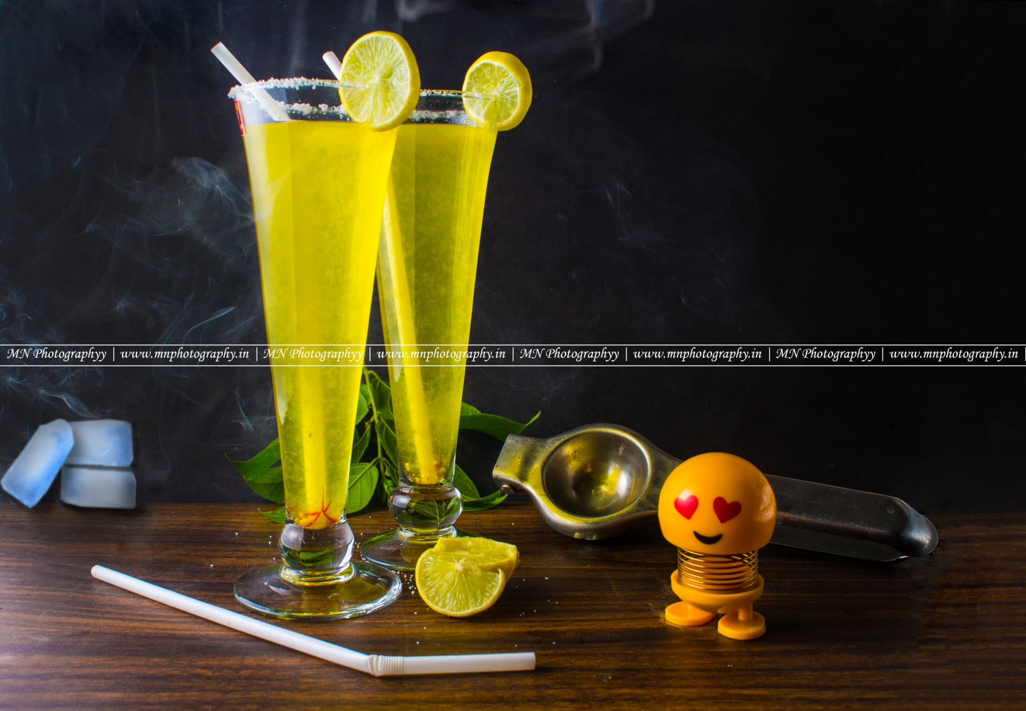 Tall lemon mojito mocktails with lime garnish — beverage photography Udaipur